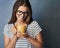 Coffee dont ask silly questions, coffee understands. Studio shot of an attractive young woman holding a coffee mug