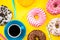 Coffee and donuts vibrant flat lay design