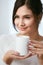 Coffee Drink. Beautiful Female Holding Cup With Hot Drink.