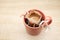 Coffee Drips in cup. Alternative brewing coffee in paper filter bags.