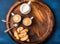 Coffee espresso, cookies and milk on wooden serving round board