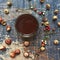 Coffee flatlay with chestnuts, acorn and fantasy berries forrest necklage