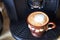 Coffee. Freshly made Flat White. Cappuccino coffee drink in a brown cup