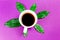 Coffee is a fuel concept - a cup on a purple background