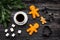 Coffee with gingebread cookies in christmas evening. Cup near spruce branch on grey wooden background top view