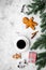 Coffee with gingebread cookies and gifts in christmas evening. Grey stone background top view copyspace