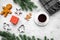 Coffee with gingebread cookies and gifts in christmas evening. Grey stone background top view copyspace