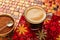 Coffee glass cup with cream on tiles red table