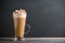 Coffee in glass on the dark wooden table