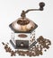 Coffee grinder and coffee beans.