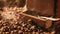 Coffee grinder standing on freshly roasted coffee beans