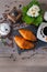 Coffee grinder, two french buttery croissant and cup of aroma coffee on wooden background.