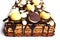 Coffee and hazelnut layered sheet cake with mirror glaze, orange mousse and chocolate decorations