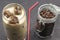 Coffee ice cubes in glass with milk. Coffee beans in glass jars