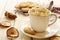 Coffee a la Vienne and crumbly cookies on wooden table