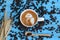 Coffee latte art with pattern the parrot in a cups on blue wooden background