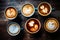 Coffee latte art on wooden background, vintage color tone, Multiple cups of coffee with variety of coffee drinks overhead view, AI