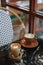 Coffee Latte and Matcha Latte on a black marble table near the window