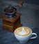 Coffee latte with vintage coffee grinder and coffee bean