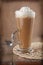 Coffee Latte with whipped cream in rustic style