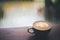 Coffee latte on wooden table, Raining, Outside