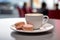 Coffee and macarons on cafe table.