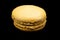 Coffee macaroon on a black background