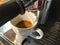 Coffee machine, Espresso shot on white cup under basket,