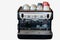 Coffee machine with mugs on top in a bar or cafe for making delicious drinks on white isolated background