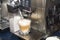 A coffee machine pours espresso into a glass cup with milk. Cappuccino making process