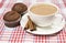 Coffee with milk, cinnamon and muffins