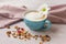 Coffee with milk and different grains, cereals and candied fruits.