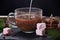 Coffee with milk preparation in glass cup with marshmallow