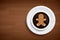 Coffee mug with gingerbread man shape on brown wood table