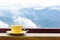 Coffee Mug On Wooden Top Table In Arial View Of Mountian