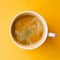 Coffee mug on yellow background. Top view. Energy, vitality, good morning concept.