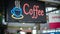 Coffee neon sign, on cafe or restaurant hang on door at entrance.