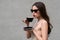 Coffee outdoor. Fashion vogue woman drinking from coffeecup. Americano cappuccino latte espresso.