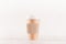 Coffee packing mockup - craft brown paper cup with white cap and kraft cup holder on white wood board, coffee shop interior.