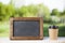 coffee paper cup with chalk board, on wood table, summer day background