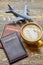 Coffee, passports and toy airplane.