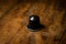 coffee pod on wooden table, hero shot, hard light, focused light