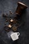 Coffee pot, cup coffee with smoke, coffee beans, sugar and sugar tongs, top view, flat lay