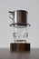 Coffee preparing in phin, traditional Vietnamese filtered coffee maker minimalist style