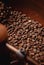 Coffee production. Roasted spinning cooler professional machines and fresh brown coffee beans
