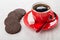 Coffee in red cup, chocolate cookies with airy rice