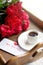 Coffee and red roses for beloved woman