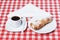 Coffee, rolls with cream tablecloth