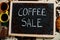 Coffee sale. Words on blackboard flat lay