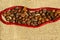 Coffee Seeds Over Textile Background. Abstract Drink Background.